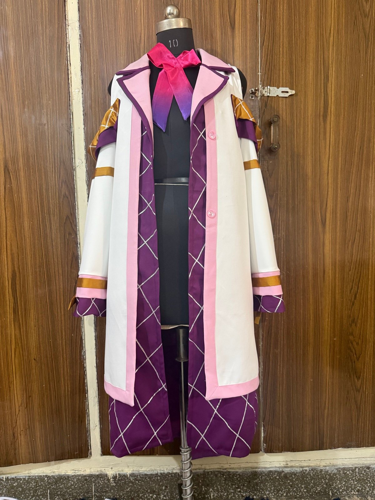 Finished pink and purple coat photographed on a mannequin
